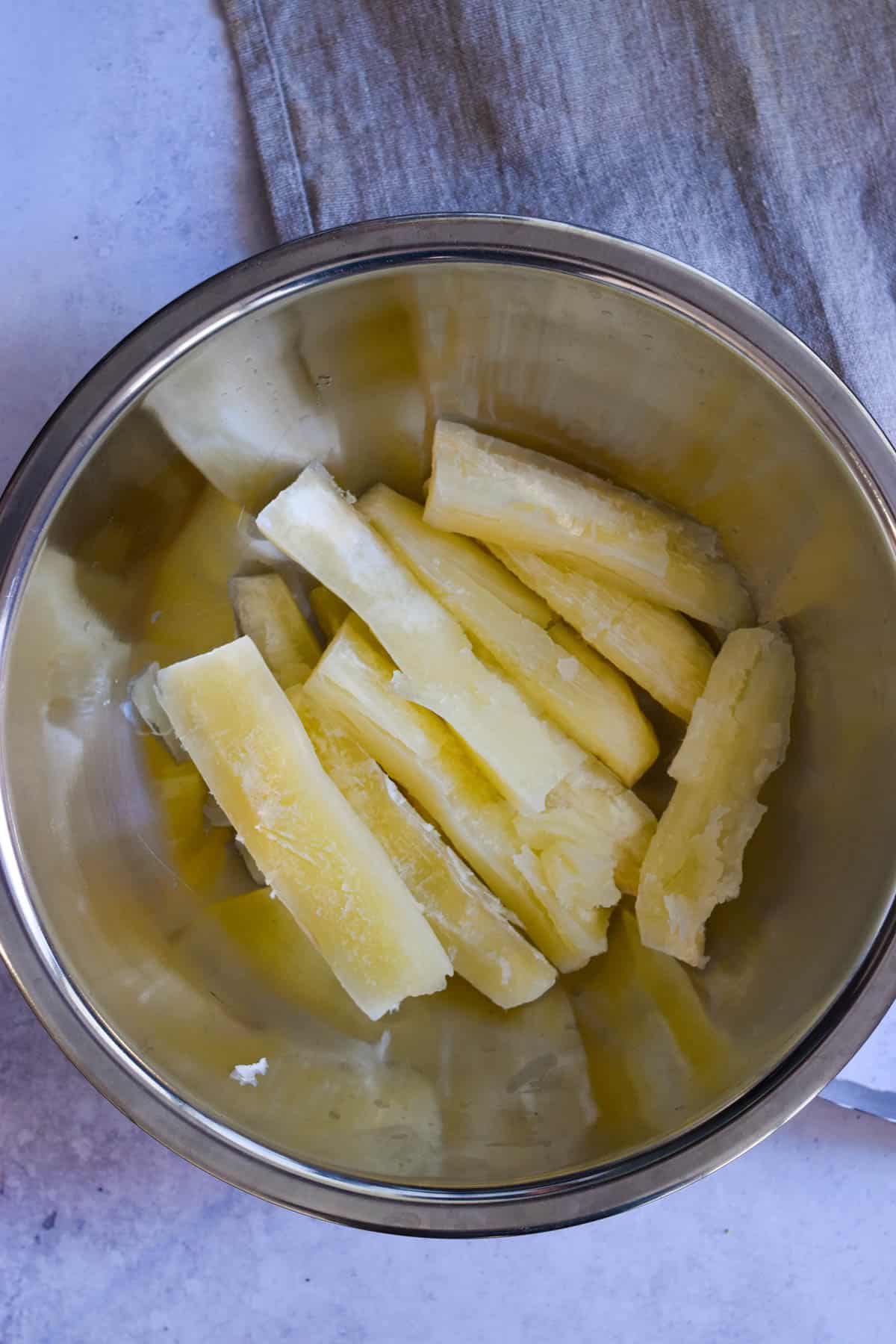 Yuca wedges in a bowl before being seasoned. 