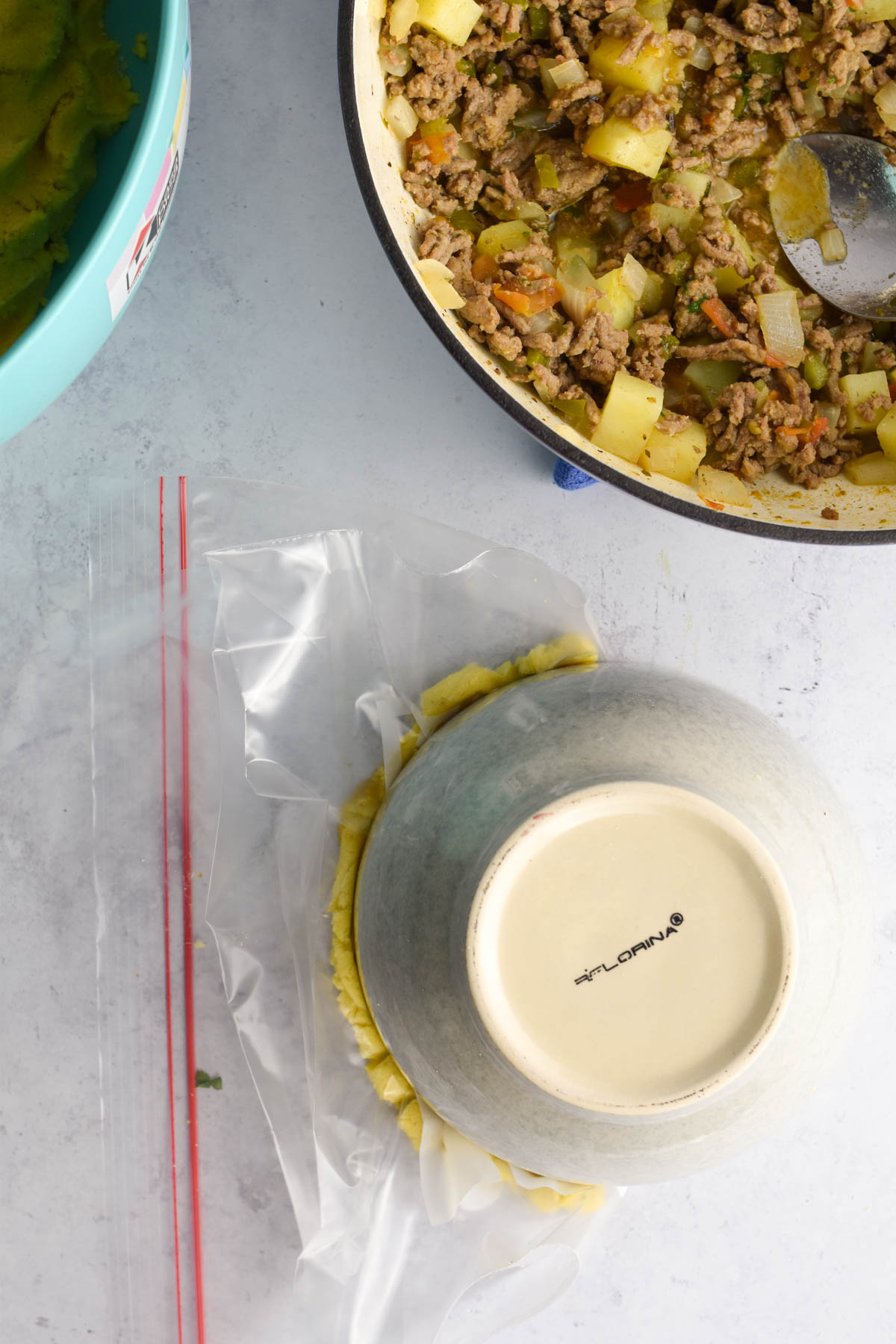 Small round bowl sealing the edges of the empanada. 